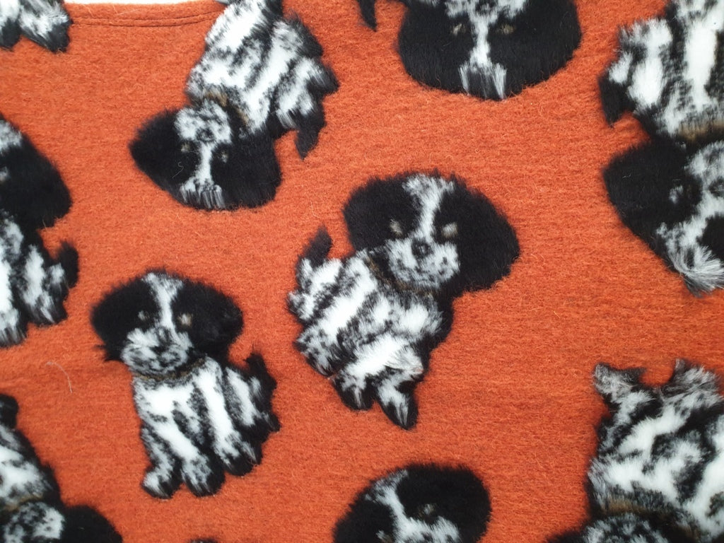 Plaid con cagnolini su fondo arancio - Il morbido plaid con tanti cagnolini in SALDO!